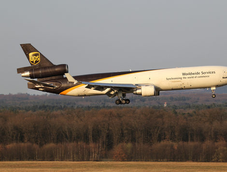A UPS airplane taking off from a runway